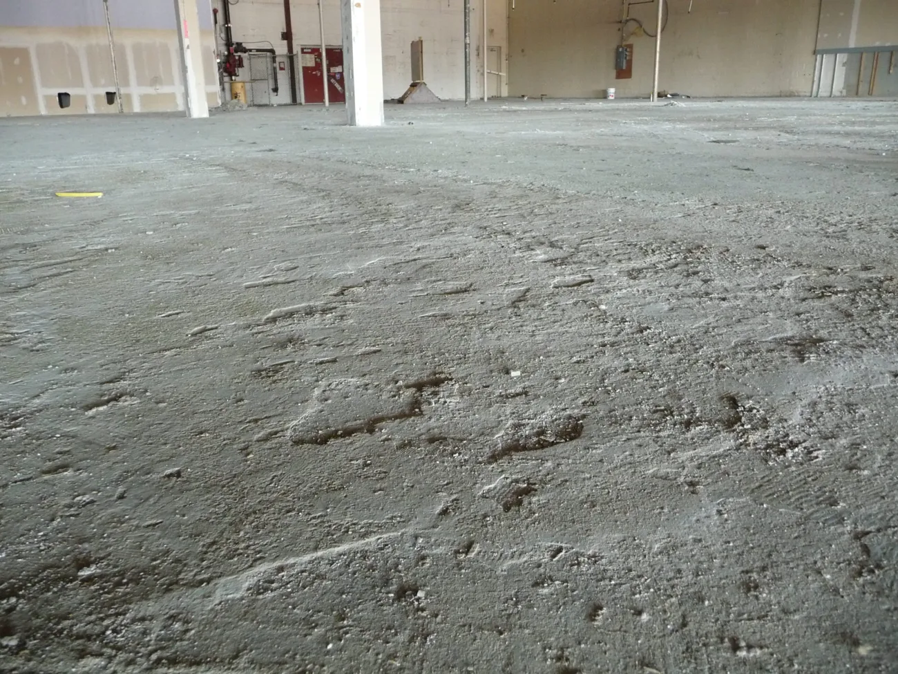 Concrete slab stripped and prepped after flooring removal