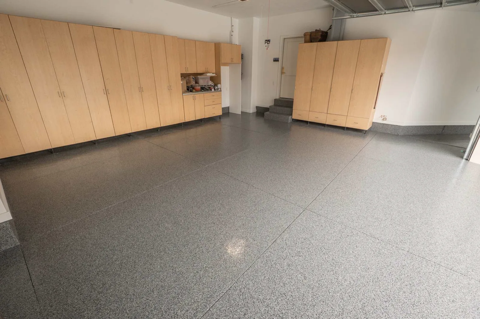 Finished flake epoxy floor in a residential garage