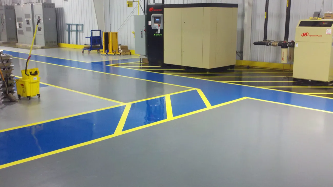 Industrial epoxy floor with safety line striping in a plant