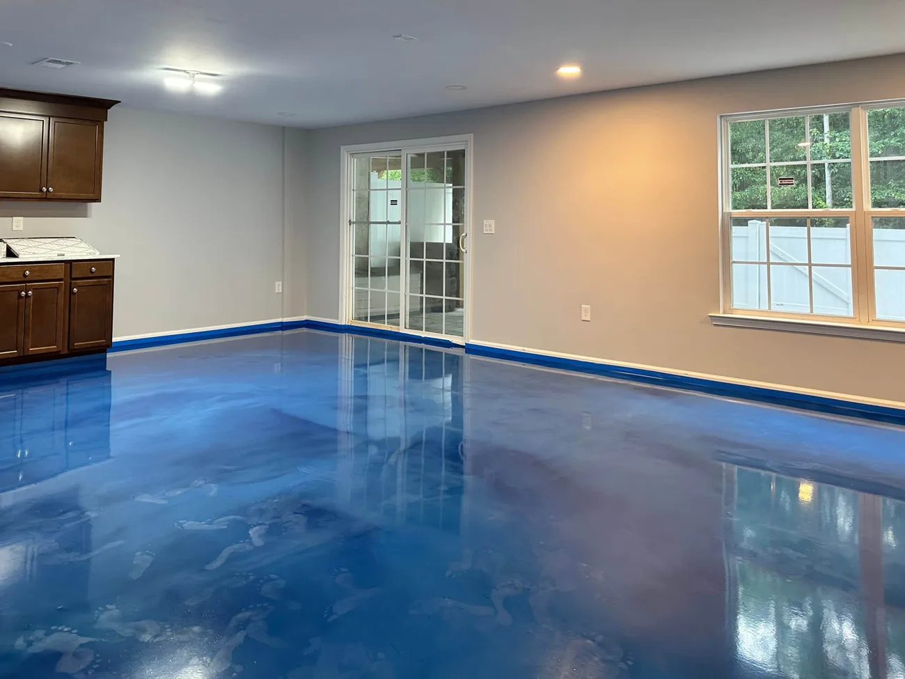 Blue metallic epoxy floor in a finished room